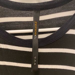Classic black and white loose fit tank with crew neck. Size medium.
